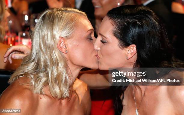 Erin Phillips of the Crows and wife Tracy Gahan kiss after Phillips was announced as the inaugural AFLW Best and Fairest winner during the The W...