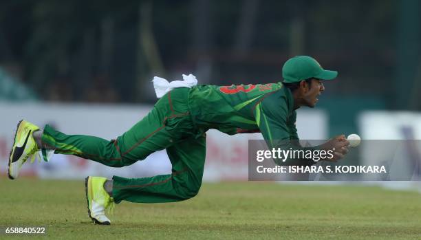 Bangladesh cricketer Mehedi Hasan drops a catch off Sri Lankan cricketer Milinda Siriwardana during the second one day international cricket match...