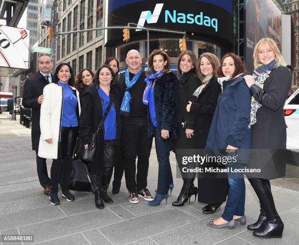 Fashion designer Carmen Marc Valvo and The De Rosa Foundation pose outside NASDAQ after ringing the Nasdaq Stock Market Opening Bell at NASDAQ on...