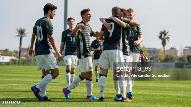 Jann-Fiete Arp of Germany celebrates the first goal for his team with his teammates during the UEFA U17 elite round match between Germany and Turkey...