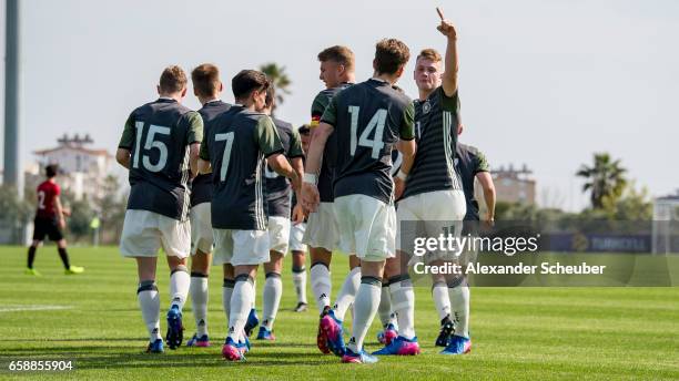 Jann-Fiete Arp of Germany celebrates the first goal for his team with his teammates during the UEFA U17 elite round match between Germany and Turkey...