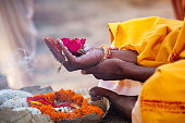 Sacred flowers are taken for worship on hand at river Ganges