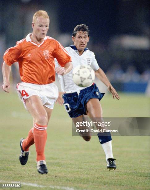 England striker Gary Lineker chases down Ronald Koeman of the Netherlands during the 1990 FIFA World Cup match at Cagliari on June 16, 1990 in...
