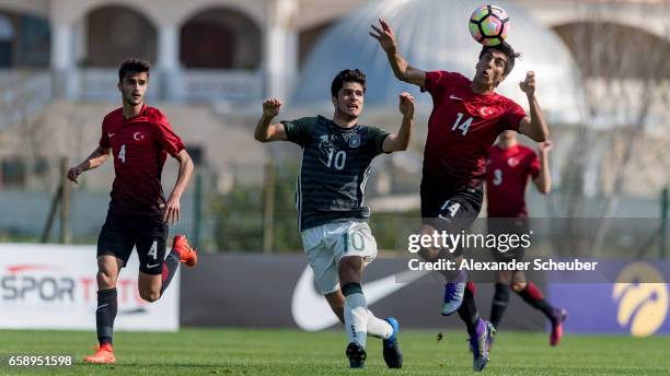 Elias Abouchabaka of Germany challenges Berkehan Bicer of Turkey during the UEFA U17 elite round match between Germany and Turkey on March 28, 2017...