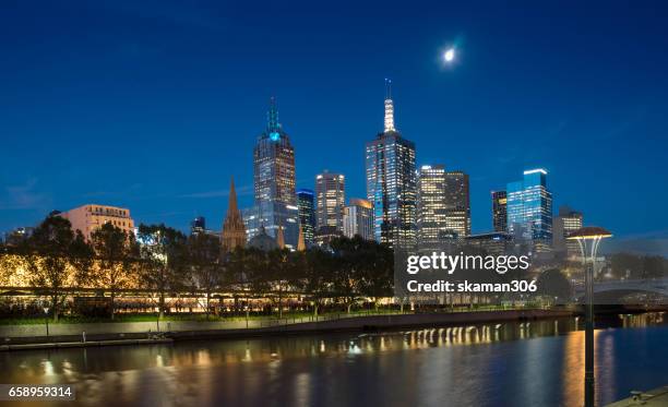 night light with urban life near south bank area close yarra river with building - may flowers stock pictures, royalty-free photos & images