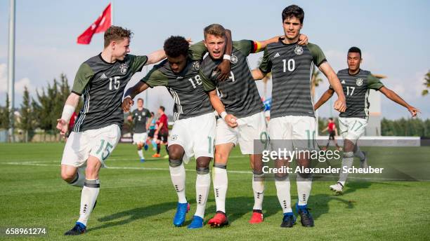 Elias Abouchabaka of Germany celebrates the third goal for his team with his teammates during the UEFA U17 elite round match between Germany and...