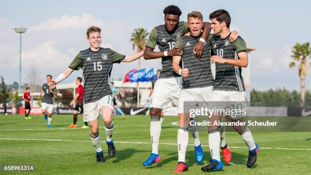 Elias Abouchabaka of Germany celebrates the third goal for his team with his teammates during the UEFA U17 elite round match between Germany and...