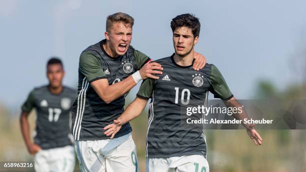 Elias Abouchabaka of Germany celebrates the third goal for his team with his teammates during the UEFA U17 elite round match between Germany and...