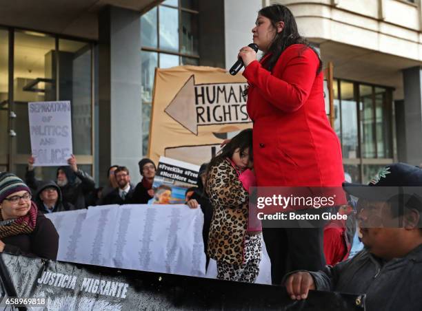 Lymarie Deida addresses the crowd outside the JFK Building in Boston on Mar. 27, 2017 on behalf of her husband, Alex Carrillo, a farm worker from...