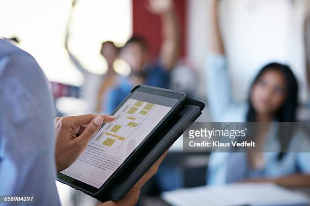 close-up of teacher using tablet in class - education technology stock pictures, royalty-free photos & images