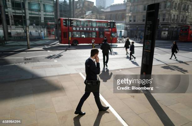 Businessman passes along Bishopsgate in London, U.K., on Tuesday, March 28, 2017. London has retained the mantle as the worlds top financial center,...