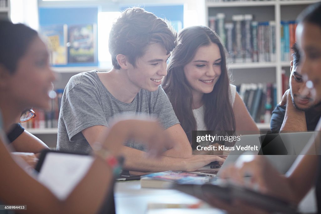 Group of students working on tablet