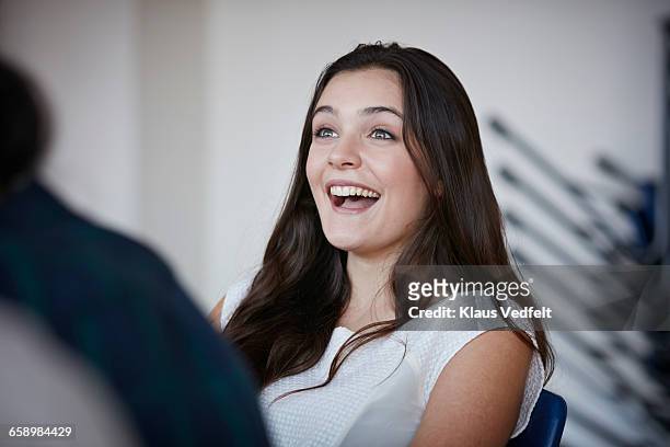 young woman laughing with co-students - faszination stock-fotos und bilder