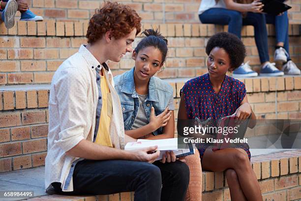 Students studying in groups outside