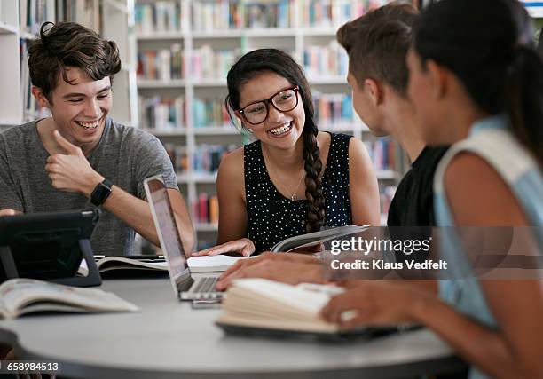 group of students working in group & laughing - teens talking stock pictures, royalty-free photos & images