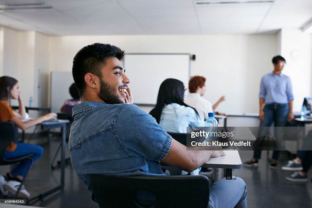 Student laughing in classroom