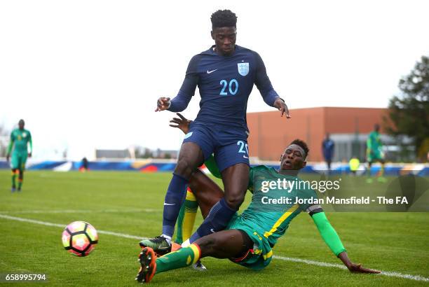 Axel Tuanzebe of England is tackled by Mamadou Mbaye of Senegal during the UEFA U20 International Friendly match between England and Senegal at Stade...