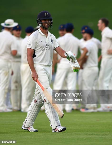James Franklin of Middlesex leaves the field after being dismissed by Craig Overton of MCC during day three of the Champion County match between...