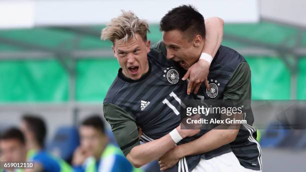 Robin Hack celebrates his team's first goal with team mate Dominik Franke during the UEFA Elite Round match between Germany U19 and Slovakia U19 at...