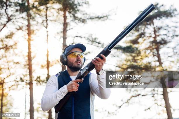 clay target shooter - shotgun stock pictures, royalty-free photos & images