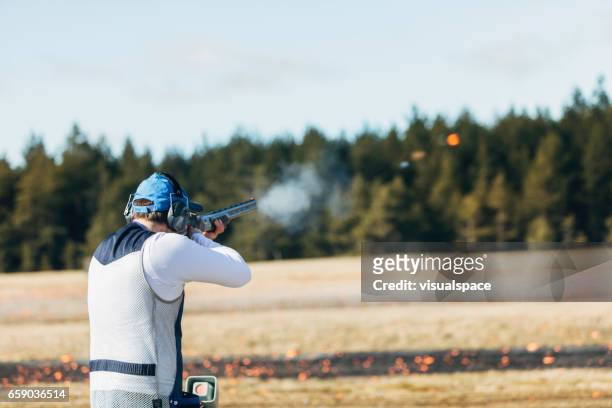 clay target shooter - shooting a weapon stock pictures, royalty-free photos & images