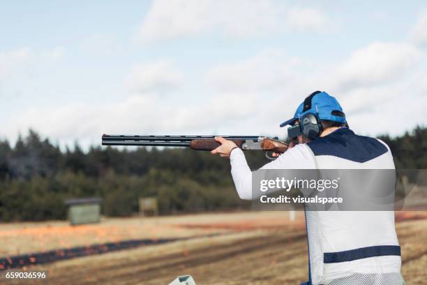 clay target shooter - skeet shooting stock pictures, royalty-free photos & images