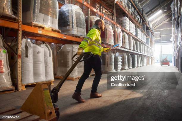 looking for the right pallet - busy warehouse stock pictures, royalty-free photos & images