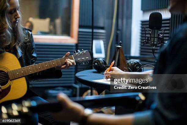two musicians in music studio, writing music - musician studio stock pictures, royalty-free photos & images