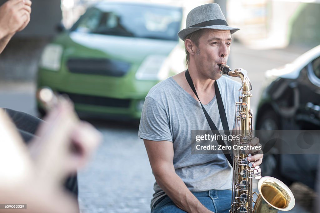 Street musician playing saxophone