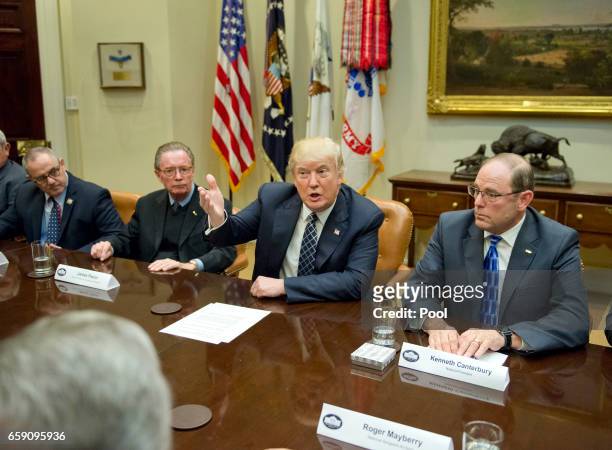 President Donald Trump makes remarks as he hosts a listening session with the Fraternal Order of Police in the Roosevelt Room of the White Houseon...