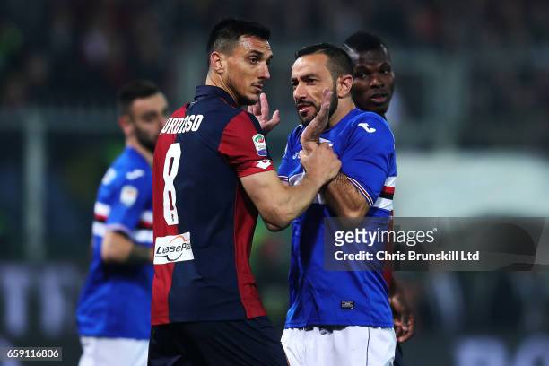 Nicolas Burdisso of Genoa CFC clashes with Fabio Quagliarella of UC Sampdoria during the Serie A match between Genoa CFC and UC Sampdoria at Stadio...