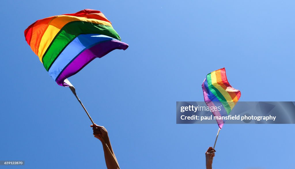 Waving rainbow flags