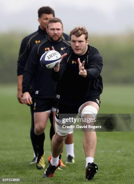 Joe Launchbury catches the ball during the Wasps training session at Broadstreet RFC on March 28, 2017 in Coventry, England.