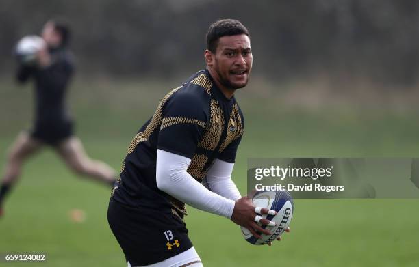 Nathan Hughes runs with the ball during the Wasps training session at Broadstreet RFC on March 28, 2017 in Coventry, England.