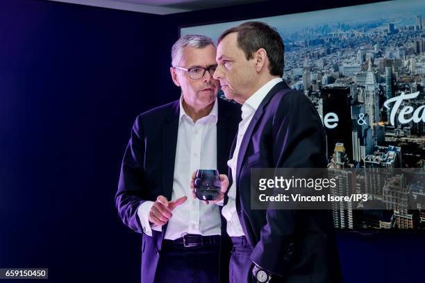 Michel Combes and Head of NextradioTV Alain Weill attend an Altice Group's press conference to confirm the purchase of ad tech company 'Teads' on...