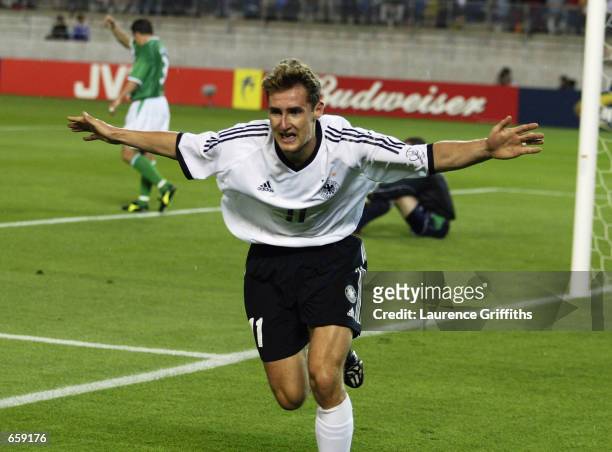 Miroslav Klose of Germany celebrates after scoring the first goal during the Germany v Republic of Ireland, Group E, World Cup Group Stage match...