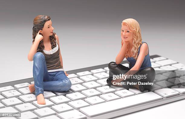 teenagers on keyboard - figurine stock pictures, royalty-free photos & images