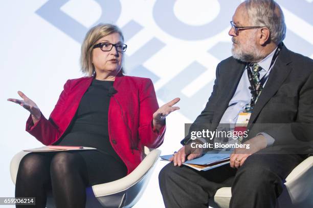 Donna Nelson, chairman of Texas Public Utility Commission, left, speaks as Bob Weisenmiller, chairman of California Energy Commission, listens during...