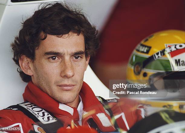 Portrait of Ayrton Senna of Brazil as he sits aboard the Honda Marlboro McLaren McLaren MP4/5 Honda V10 during practice for the Hungarian Grand Prix...