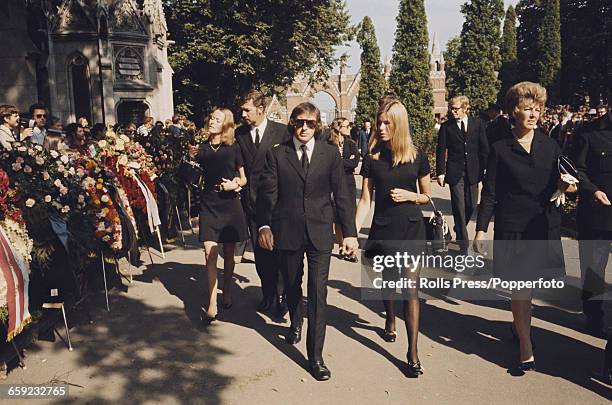 View of Jackie Stewart and his wife Helen attending the funeral of German born Austrian racing driver Jochen Rindt , killed competing in the Italan...