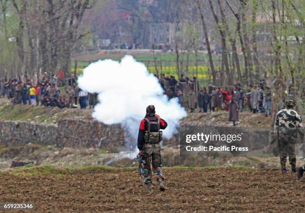 Kashmiri Muslim supporters pelting stones on government forces near an encounter site in Chadoora area of Central Kashmirs Budgam district. One...