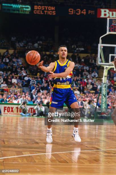 Chris Jackson of the Denver Nuggets passes the ball against the Boston Celtics circa 1993 at the Boston Garden in Boston, Massachussetts. NOTE TO...
