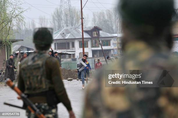 Kashmiri protesters clash with security forces near a site of a gun-battle in Chadoora, on March 28, 2017 in Badgam district south of Srinagar,...