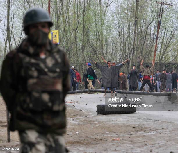 Kashmiri protesters shout slogans near a site of a gun-battle in Chadoora, on March 28, 2017 in Badgam district south of Srinagar, India. One...