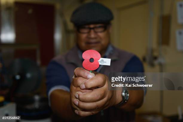 Malaya and Vietnam veteran David Rarere holds a poppy at the Royal New Zealand Returned and Services' Association Poppy Factory on March 27, 2017 in...