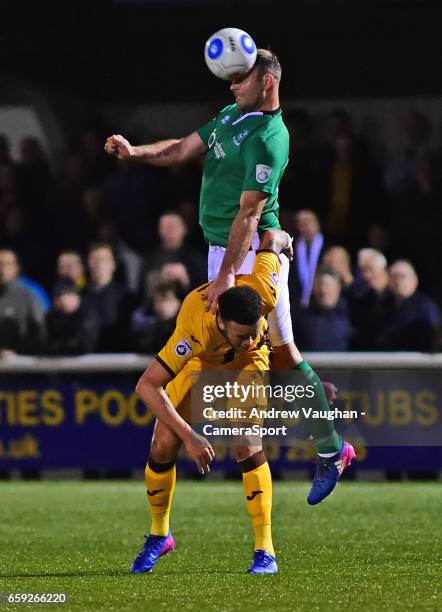 Lincoln City's Matt Rhead vies for possession with Sutton United's Louis John during the Vanarama National League match between Sutton United and...