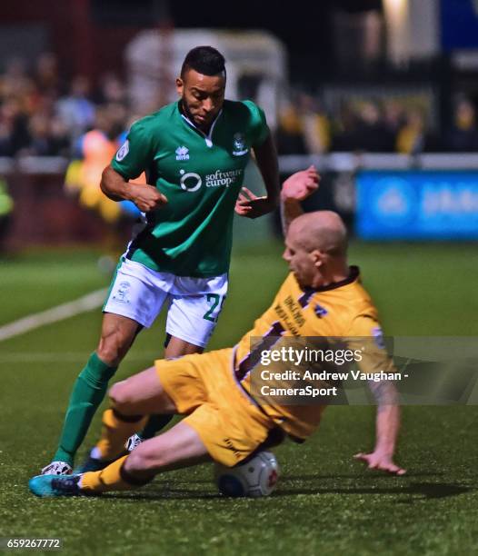 Lincoln City's Nathan Arnold vies for possession with Sutton United's Nicky Bailey during the Vanarama National League match between Sutton United...