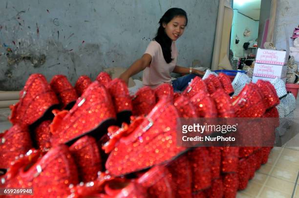 Workers creating slippers home industry in village Cikaret, Bogor, West Java, on March 28, 2017. Every day artisans in Kampung Cikaret famous as a...