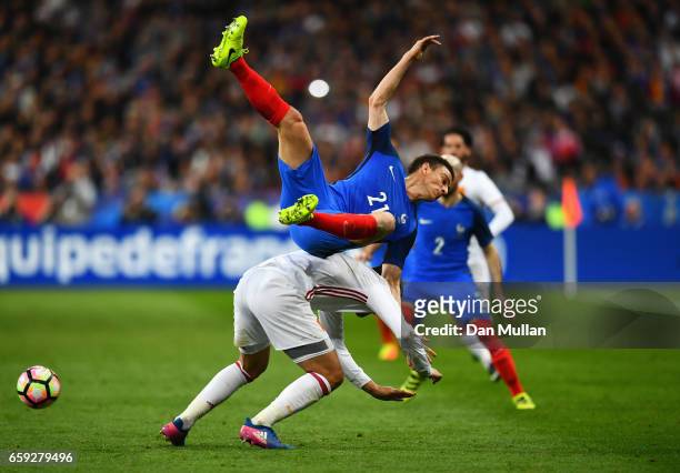 Laurent Koscielny of France clashes with Alvaro Morata of Spain during the International Friendly match between France and Spain at Stade de France...