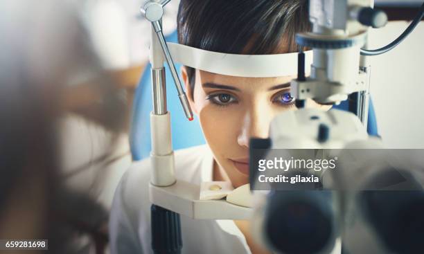 eyesight exam. - retinal scan stock pictures, royalty-free photos & images